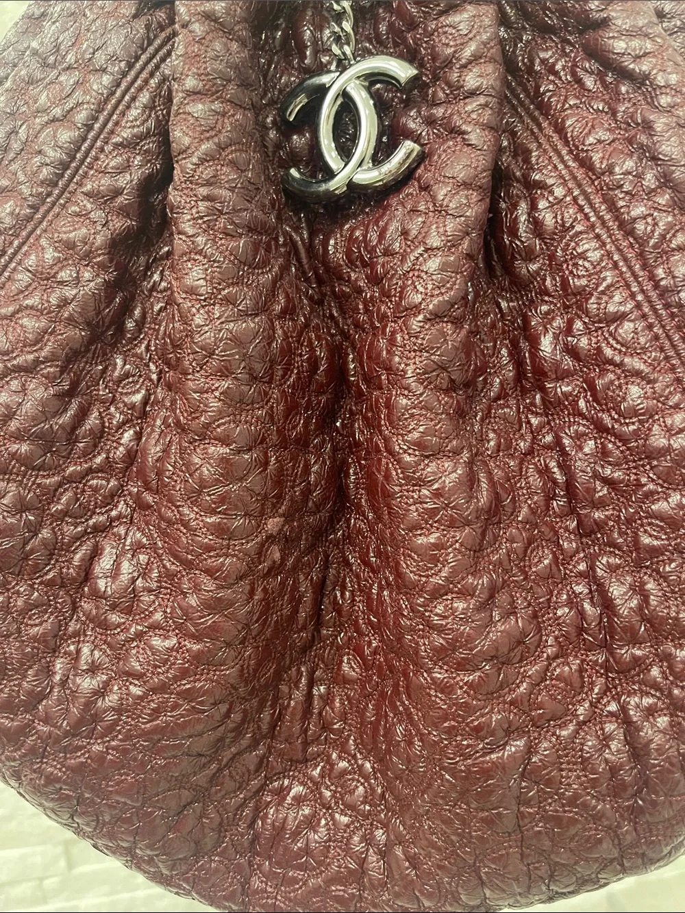 Authentic CHANEL Camelia in Bordeaux with CC Charm